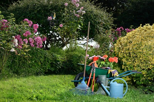 Gardener with tools and safety gear at the start of a garden job